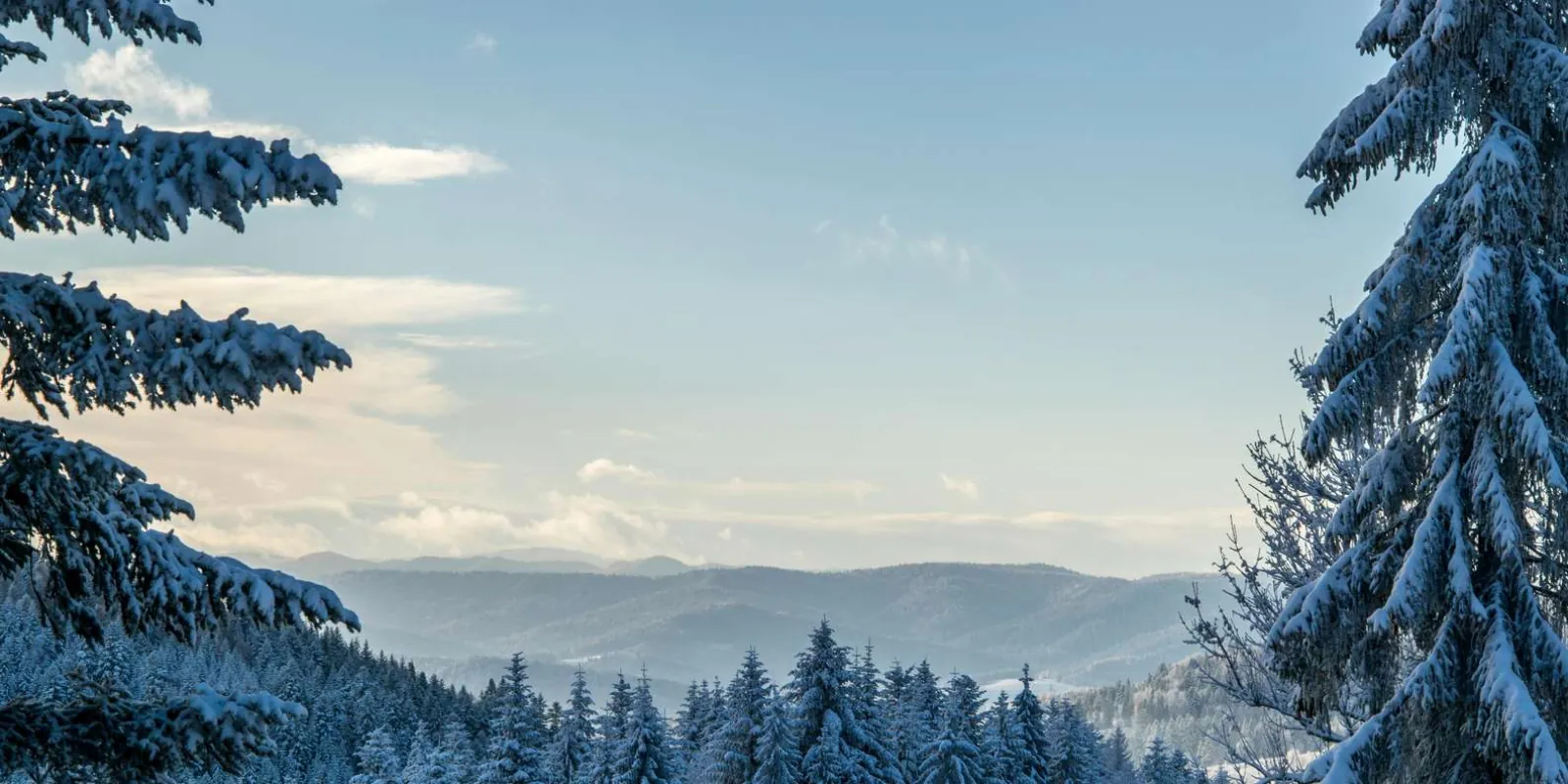 Panoramic view of snow-covered hills and mountains from the Finger Mountain overlook